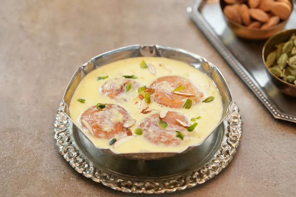 Rasabali, fried chhena patties in thickened sweet milk